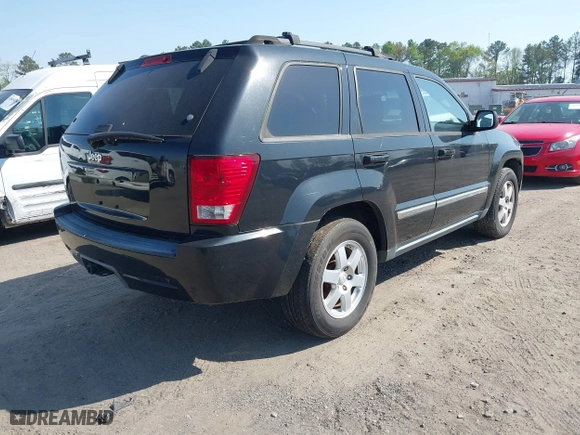 2010 Jeep Grand Cherokee Laredo with VIN 1J4PR4GK5AC120373, listed as a IAAI auction lot 42071835 with 101,949 mi miles. Bid and sale history available at carsss.com. Image 4.