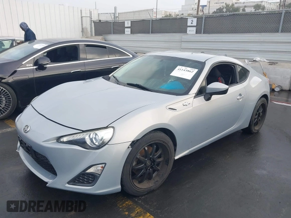 2013 Scion FR-S with VIN JF1ZNAA1XD1729862, listed as a IAAI auction lot 41143862 with 64,208 mi miles. Bid and sale history available at carsss.com. Image 2.