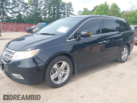 2011 Honda Odyssey Touring with VIN 5FNRL5H90BB070472, listed as a IAAI auction lot 42367710 with 203,589 mi miles and . Bid and sale history available at DreamBid. Image 17.