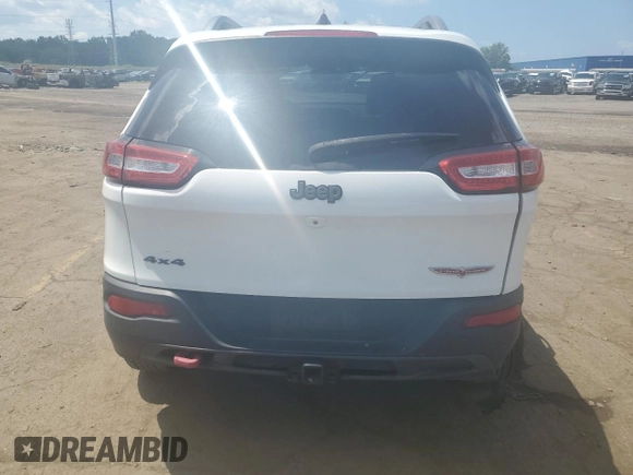2015 Jeep Cherokee Trailhawk with VIN 1C4PJMBSXFW651000, listed as a Copart auction lot 64110515 with 135,571 mi miles and Clean title. Bid and sale history available at DreamBid. Image 6.