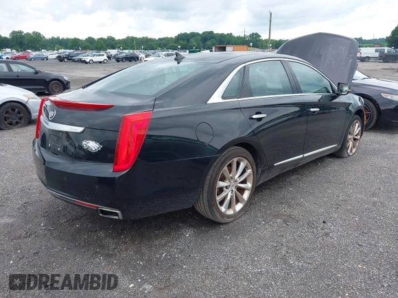 2013 Cadillac XTS Luxury z VIN 2G61P5S34D9183065, wystawiony jako IAAI lot #42665741 z przebiegiem 209 585 mil mil oraz . Historia ofert i sprzedaży dostępna na DreamBid. Obrazek 4.
