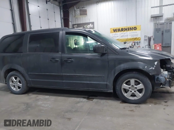 2012 Dodge Grand Caravan SXT with VIN 2C4RDGCG7CR358266, listed as a IAAI auction lot 41582428 with 169,137 mi miles and . Bid and sale history available at DreamBid. Image 13.