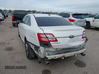 2013 Ford Taurus SEL with VIN 1FAHP2E87DG111530, listed as a IAAI auction lot 41322957 with 183,103 mi miles. Bid and sale history available at carsss.com. Image 3.