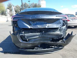 2024 Tesla Model 3 with VIN 5YJ3E1EA9RF849936, listed as a IAAI auction lot 41707656 with 18,749 mi miles and . Bid and sale history available at DreamBid. Image 6.