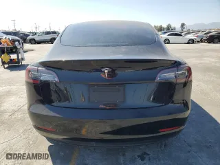 2021 Tesla Model 3 Standard Range Plus with VIN 5YJ3E1EAXMF069467, listed as a Copart auction lot 63273134 with 66,393 mi miles and Salvage Title. Bid and sale history available at carsss.com. Image 6.