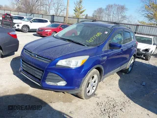 2013 Ford Escape SE with VIN 1FMCU0GX9DUC33969, listed as a IAAI auction lot 41737582 with 132,629 mi miles. Bid and sale history available at carsss.com. Image 2.