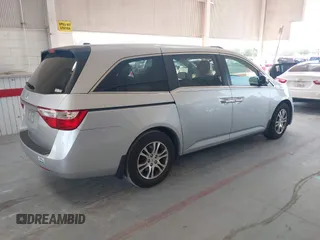 2012 Honda Odyssey EX-L with VIN 5FNRL5H67CB005013, listed as a IAAI auction lot 42295586 with 200,611 mi miles and . Bid and sale history available at DreamBid. Image 4.