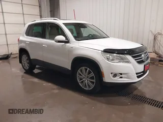 2010 Volkswagen Tiguan S with VIN WVGBV7AX2AW514358, listed as a IAAI auction lot 41776935 with 124,844 mi miles and . Bid and sale history available at DreamBid. Image 1.