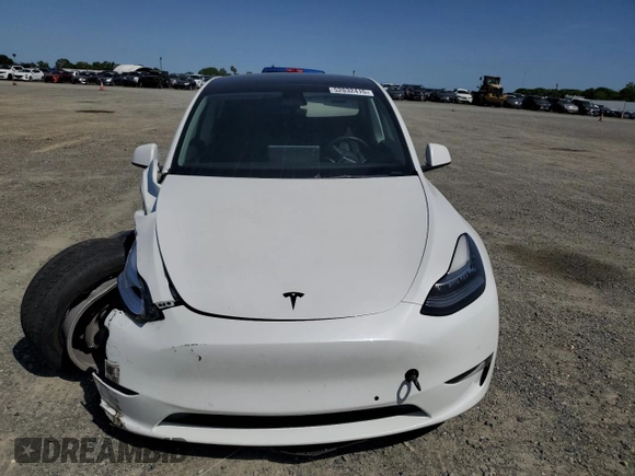 2022 Tesla Model Y Long Range z VIN 7SAYGAEE6NF492070, wystawiony jako Copart lot #52032415 z przebiegiem 143 732 mil mil oraz Szkody całkowita. Historia ofert i sprzedaży dostępna na DreamBid. Obrazek 5.
