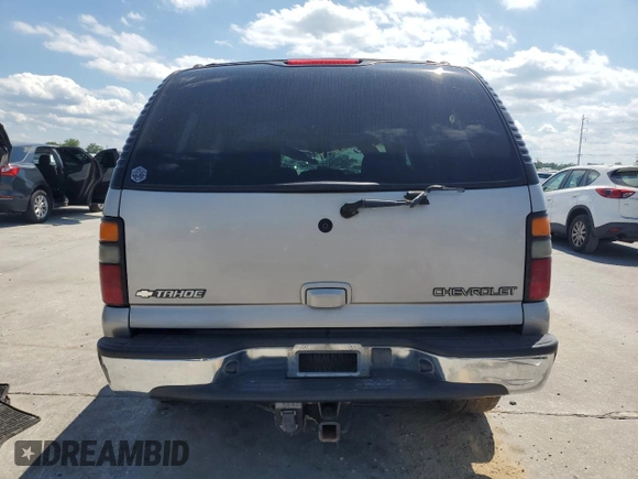 2004 Chevrolet Tahoe LS z VIN 1GNEC13Z14R277634, wystawiony jako Copart lot #56374955 z przebiegiem 247 285 mil mil oraz Szkoda całkowita • Salvage title. Historia ofert i sprzedaży dostępna na DreamBid. Obrazek 6.
