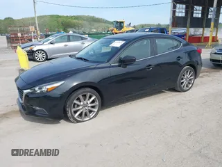 2017 Mazda 3 Touring z VIN 3MZBN1V74HM133565, wystawiony jako IAAI lot #42160836 z przebiegiem 104 997 mil mil oraz . Historia ofert i sprzedaży dostępna na DreamBid. Obrazek 17.
