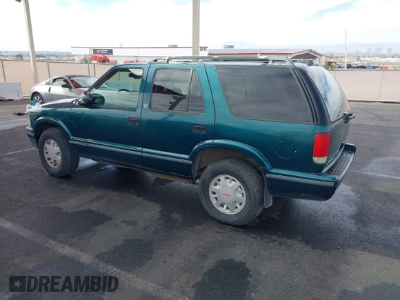 1997 GMC Jimmy SLS with VIN 1GKDT13W7V2516192, listed as a IAAI auction lot 41442979 with 154,518 mi miles. Bid and sale history available at carsss.com. Image 3.