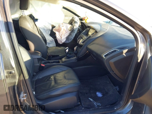 2015 Ford Focus Titanium z VIN 1FADP3N23FL368324, wystawiony jako IAAI lot #41387070 z przebiegiem Nie podano mil oraz . Historia ofert i sprzedaży dostępna na DreamBid. Obrazek 5.