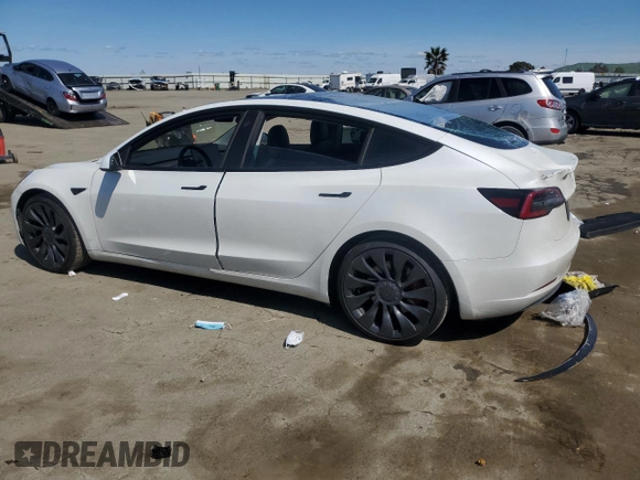 2021 Tesla Model 3 Performance with VIN 5YJ3E1ECXMF091342, listed as a Copart auction lot 49987595 with 120,881 mi miles and Salvage Title. Bid and sale history available at DreamBid. Image 2.
