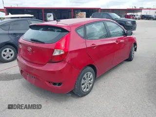 2014 Hyundai Accent SE z VIN KMHCU5AE7EU145704, wystawiony jako IAAI lot #42357042 z przebiegiem 96 773 mil mil oraz . Historia ofert i sprzedaży dostępna na DreamBid. Obrazek 4.