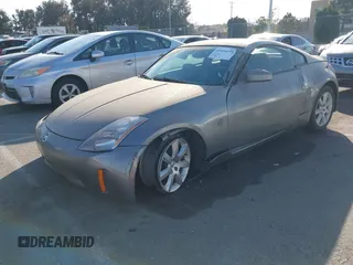 2004 Nissan 350Z Touring with VIN JN1AZ34E84T060682, listed as a IAAI auction lot 41616199 with 209,814 mi miles. Bid and sale history available at carsss.com. Image 2.