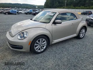 2015 Volkswagen Beetle with VIN 3VW5A7AT9FM815899, listed as a Copart auction lot 63074125 with 77,214 mi miles and Salvage title. Bid and sale history available at DreamBid. Image 1.