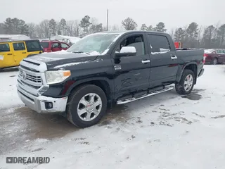 2014 Toyota Tundra 4WD Truck Platinum with VIN 5TFAW5F17EX403262, listed as a IAAI auction lot 41607938 with 147,898 mi miles. Bid and sale history available at carsss.com. Image 17.