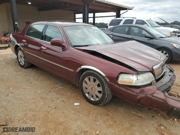 2003 Lincoln Town Car Cartier with VIN 1LNHM83W73Y638138, listed as a Copart auction lot 73698774 with 205,583 mi miles and Salvage Title. Bid and sale history available at carsss.com. Image 4.