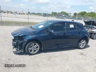 2019 Toyota Corolla Hatchback SE with VIN JTNK4RBE3K3061589, listed as a IAAI auction lot 42123273 with 90,491 mi miles. Bid and sale history available at carsss.com. Image 14.