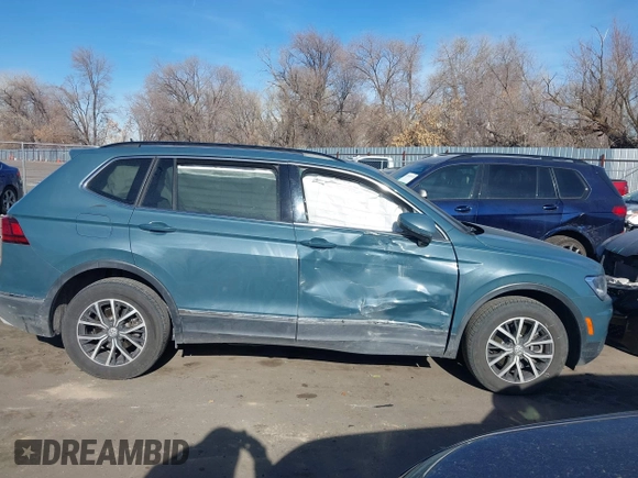 2021 Volkswagen Tiguan SE with VIN 3VV2B7AXXMM089913, listed as a IAAI auction lot 41402158 with 68,158 mi miles and . Bid and sale history available at DreamBid. Image 13.
