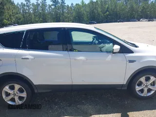 2014 Ford Escape SE with VIN 1FMCU9G90EUB76911, listed as a IAAI auction lot 42143518 with 123,466 mi miles and . Bid and sale history available at DreamBid. Image 13.
