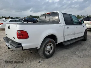 2001 Ford F-150 XLT with VIN 1FTRW07L01KC60815, listed as a Copart auction lot 87022424 with 205,304 mi miles and Salvage title. Bid and sale history available at DreamBid. Image 3.