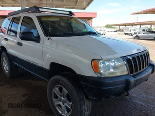 2000 Jeep Grand Cherokee Laredo z VIN 1J4GW48S4YC299149, wystawiony jako IAAI lot #42347792 z przebiegiem 229 007 mil mil oraz . Historia ofert i sprzedaży dostępna na DreamBid. Obrazek 1.