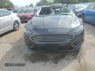 2018 Ford Fusion SE z VIN 3FA6P0H78JR261102, wystawiony jako Copart lot #69963883 z przebiegiem 120 068 mil mil oraz Czysty tytuł • Clean title. Historia ofert i sprzedaży dostępna na DreamBid. Obrazek 5.