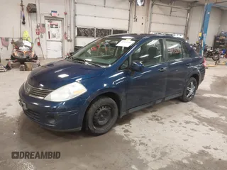 2009 Nissan Versa 1.8 S with VIN 3N1BC11E79L440560, listed as a IAAI auction lot 41975289 with 158,726 mi miles. Bid and sale history available at carsss.com. Image 2.