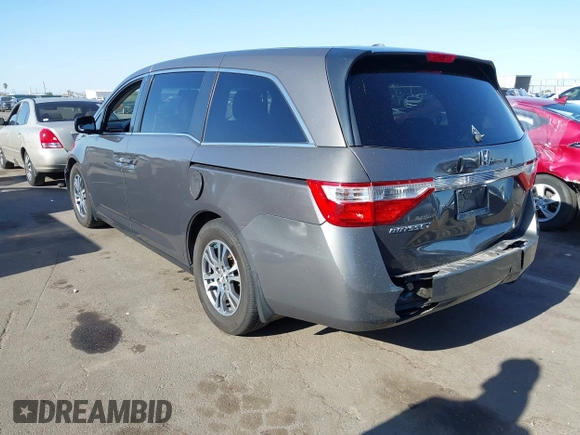 2011 Honda Odyssey EX-L with VIN 5FNRL5H6XBB083980, listed as a IAAI auction lot 42100308 with 191,361 mi miles and . Bid and sale history available at carsss.com. Image 3.