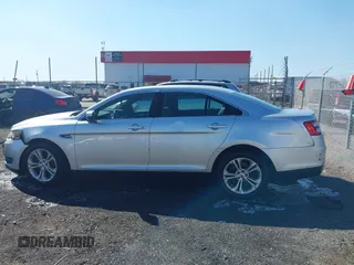 2013 Ford Taurus SEL with VIN 1FAHP2E8XDG164903, listed as a IAAI auction lot 41580690 with 163,128 mi miles and . Bid and sale history available at carsss.com. Image 14.