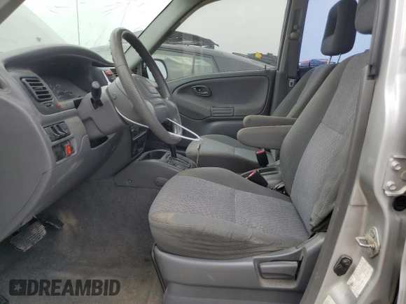 2002 Chevrolet Tracker with VIN 2CNBE13C926934704, listed as a Copart auction lot 70717194 with 189,076 mi miles and Salvage title. Bid and sale history available at DreamBid. Image 7.