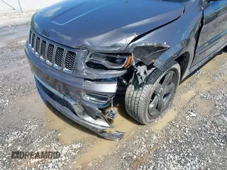 2016 Jeep Grand Cherokee Overland with VIN 1C4RJFCG6GC417485, listed as a IAAI auction lot 42210973 with 115,612 mi miles and . Bid and sale history available at DreamBid. Image 6.