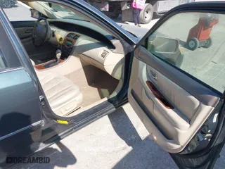2004 Toyota Avalon XL with VIN 4T1BF28B24U342374, listed as a IAAI auction lot 42042336 with 250,984 mi miles. Bid and sale history available at carsss.com. Image 5.