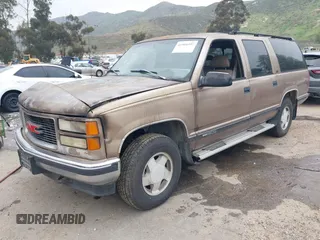 1995 GMC Suburban z VIN 1GKFK16K5SJ723038, wystawiony jako IAAI lot #41904397 z przebiegiem 142 082 mil mil oraz . Historia ofert i sprzedaży dostępna na DreamBid. Obrazek 2.