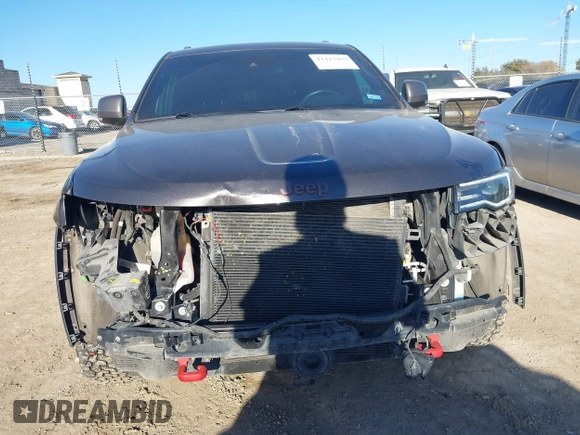 2018 Jeep Grand Cherokee Trailhawk with VIN 1C4RJFLT9JC244212, listed as a IAAI auction lot 41443469 with 77,953 mi miles and . Bid and sale history available at DreamBid. Image 13.
