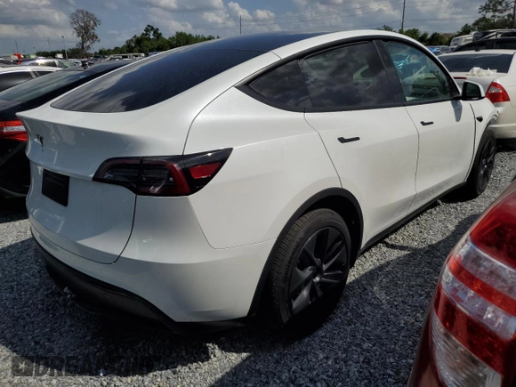 2025 Tesla Model Y Long Range with VIN 7SAYGDED4SF232433, listed as a Copart auction lot 51504015 with Not Provided miles and Salvage Title. Bid and sale history available at DreamBid. Image 3.