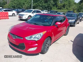 2013 Hyundai Veloster w/Black Int with VIN KMHTC6AD9DU135318, listed as a IAAI auction lot 42632212 with 97,485 mi miles and . Bid and sale history available at DreamBid. Image 2.