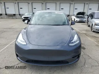 2023 Tesla Model Y Long Range with VIN 7SAYGDEE2PA024693, listed as a Copart auction lot 52595935 with 35,179 mi miles and Salvage Title. Bid and sale history available at DreamBid. Image 5.
