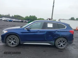 2018 BMW X1 xDrive28i with VIN WBXHT3C32J5L33213, listed as a IAAI auction lot 42513235 with 75,918 mi miles and . Bid and sale history available at DreamBid. Image 14.