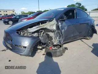 2022 Tesla Model Y Performance z VIN 7SAYGDEF8NF384270, wystawiony jako Copart lot #56718215 z przebiegiem Nie podano mil oraz Szkoda całkowita • Salvage title. Historia ofert i sprzedaży dostępna na DreamBid. Obrazek 1.