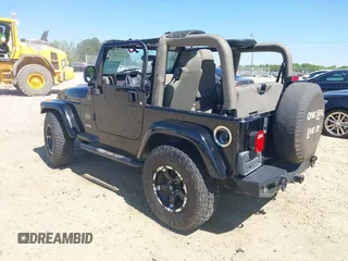 2004 Jeep Wrangler Sahara with VIN 1J4FA59S74P801296, listed as a IAAI auction lot 42049291 with 152,208 mi miles and . Bid and sale history available at DreamBid. Image 3.