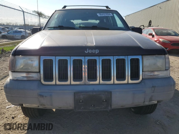 1998 Jeep Grand Cherokee Laredo with VIN 1J4FX58SXWC144715, listed as a Copart auction lot 86423594 with 93,936 mi miles and Clean Title. Bid and sale history available at carsss.com. Image 5.
