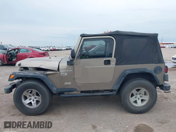 2005 Jeep Wrangler X with VIN 1J4FA39S55P350696, listed as a IAAI auction lot 42367283 with 117,941 mi miles and . Bid and sale history available at DreamBid. Image 14.