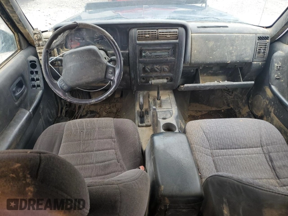 2000 Jeep Cherokee with VIN 1J4FF48S7YL209729, listed as a Copart auction lot 53647685 with 268,552 mi miles and Salvage title. Bid and sale history available at DreamBid. Image 8.