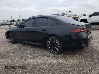 2024 BMW 5 Series 530i with VIN WBA43FJ00RCP78785, listed as a Copart auction lot 74415334 with 3,987 mi miles and Salvage Title. Bid and sale history available at carsss.com. Image 2.