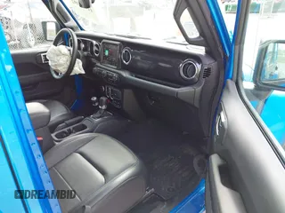 2023 Jeep Wrangler Sahara with VIN 1C4HJXEG4PW584800, listed as a IAAI auction lot 41908392 with 22,108 mi miles and . Bid and sale history available at DreamBid. Image 5.