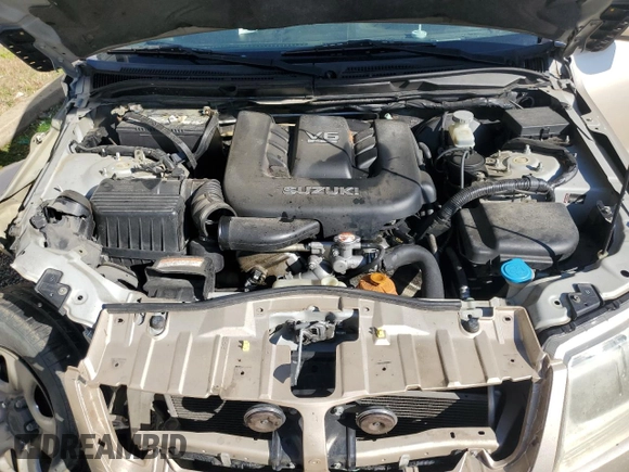 2007 Suzuki Grand Vitara z VIN JS3TE941X74201723, wystawiony jako Copart lot #46651695 z przebiegiem 282 768 mil mil oraz Szkoda całkowita • Salvage title. Historia ofert i sprzedaży dostępna na DreamBid. Obrazek 13.