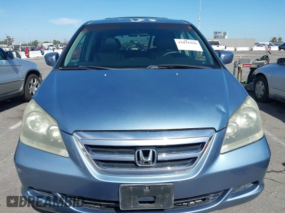 2006 Honda Odyssey EX-L z VIN 5FNRL38706B075356, wystawiony jako IAAI lot #42021960 z przebiegiem 120 455 mil mil oraz . Historia ofert i sprzedaży dostępna na DreamBid. Obrazek 12.